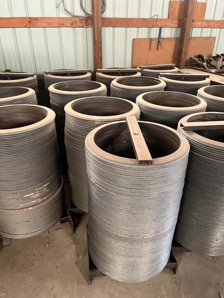 Replacement puller wheel ring beside a spoked beet lifter wheel