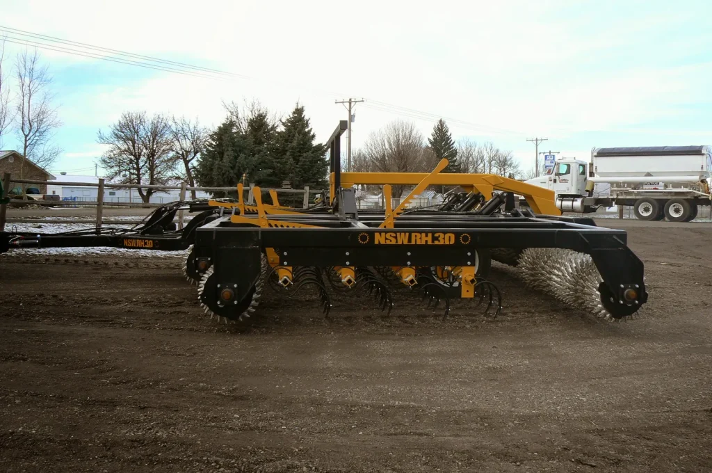 Northside roller harrow with S-tine rows and packer rollers, side view