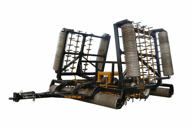 Folding roller harrow in transport position
