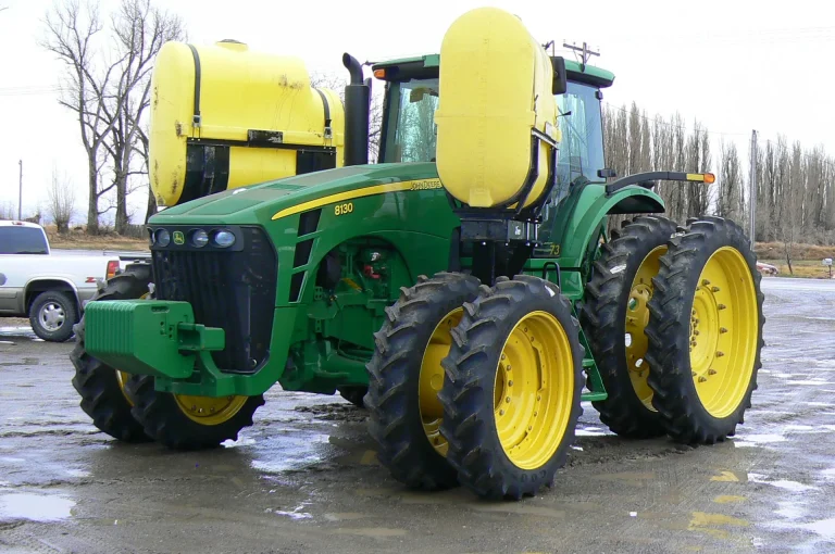 Tractor with saddle tank mounts, side view
