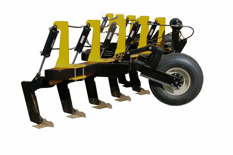 V-ripper with hydraulic reset shanks